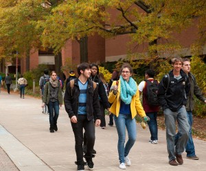 Students walking down Academic Row on Main Campus during Fall